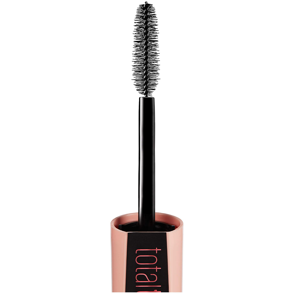 Maybelline Total Temptation tube in hand for scale and travel-friendly size benefit