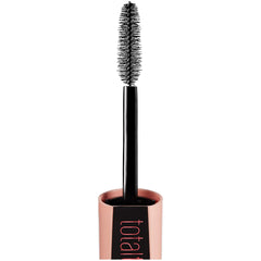 Maybelline Total Temptation tube in hand for scale and travel-friendly size benefit