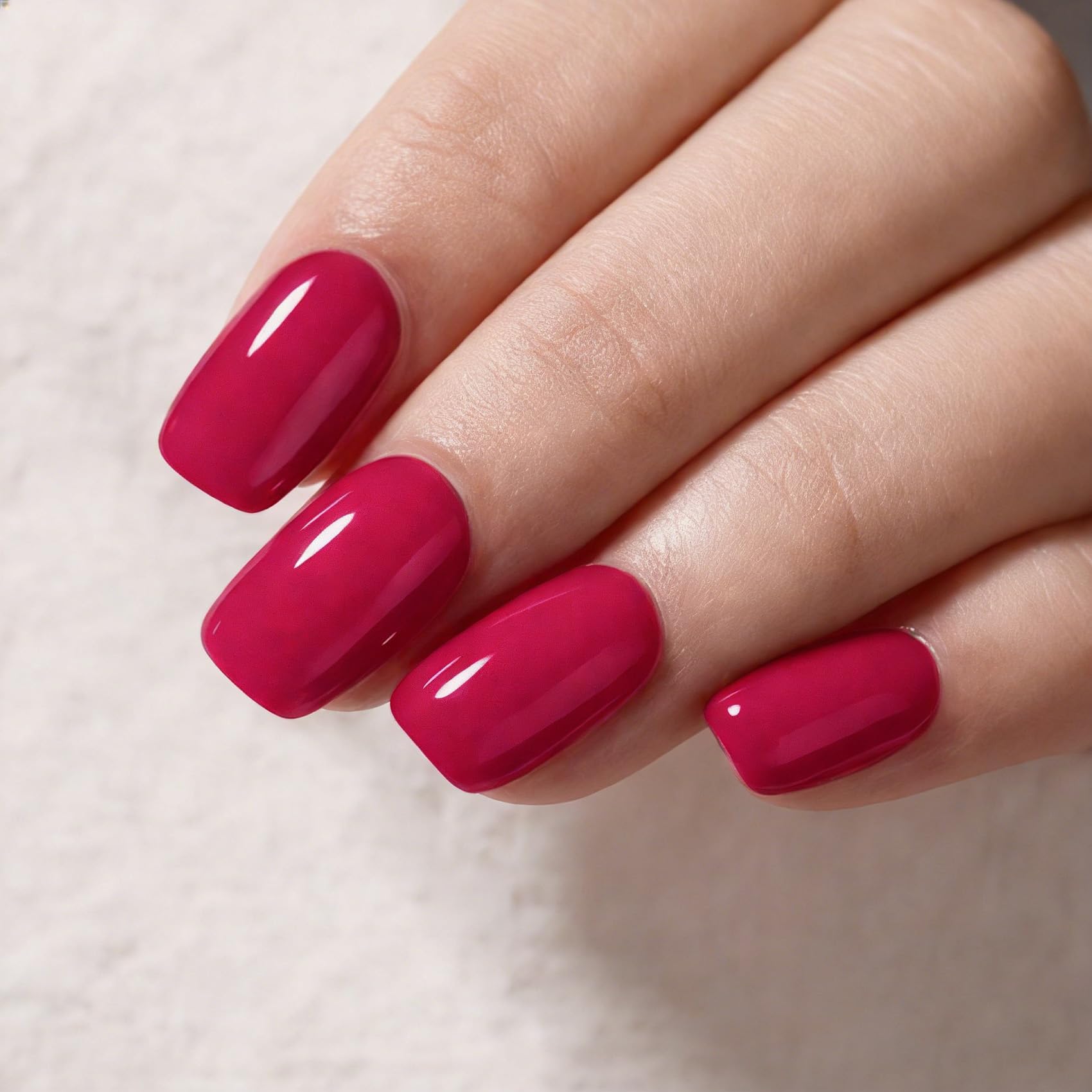 MAYCHAO swatch on fingernails, displays vibrant rose-berry color