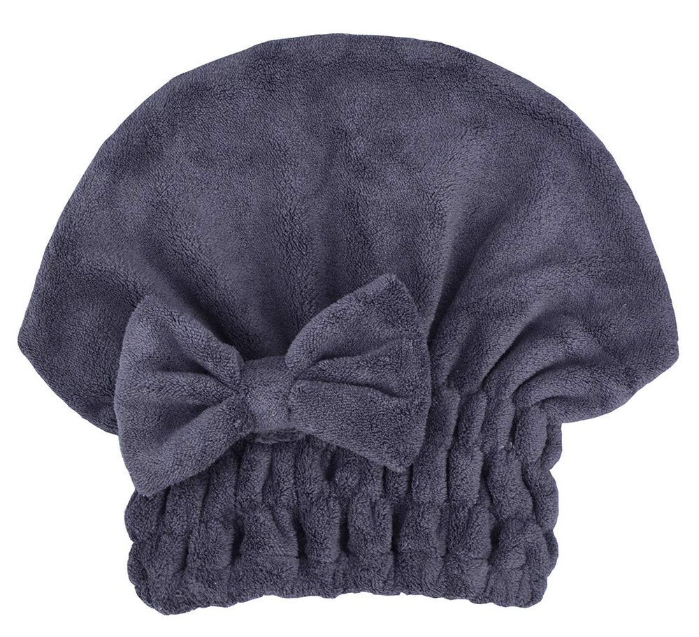 MAYOUTH woman wearing turban cap while doing skincare showing hands-free convenience