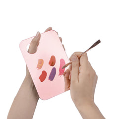 Mcduyant palette held in hand to show size and ergonomic thumb comfort