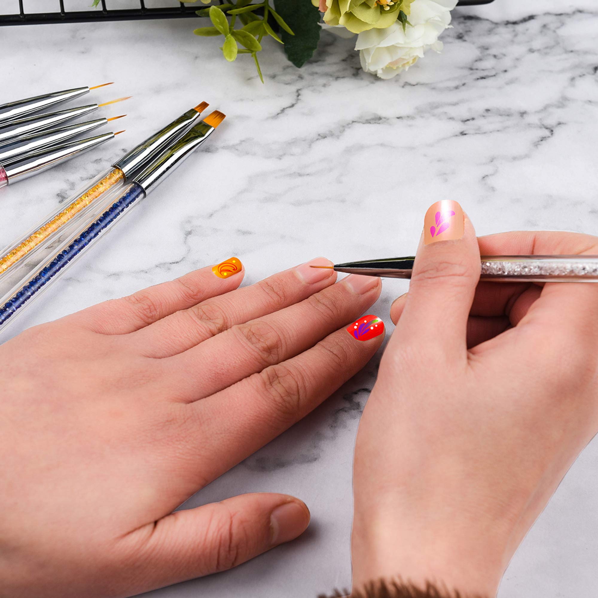 Mcduyant brushes next to a hand for scale and comfortable grip demonstration