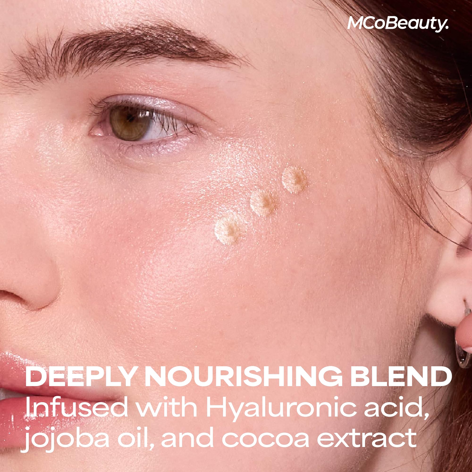 MCoBeauty model applying drops to cheekbone for natural radiance