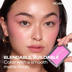 MCoBeauty blush red in use with brush application for effortless buildable color