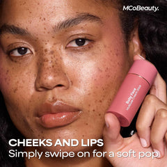 MCoBeauty Lucy applied on lips closeup showing pigmented rose tint and hydrated finish