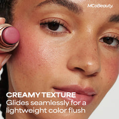 MCoBeauty Lucy single swipe swatch on arm showing buildable deep rose pigment