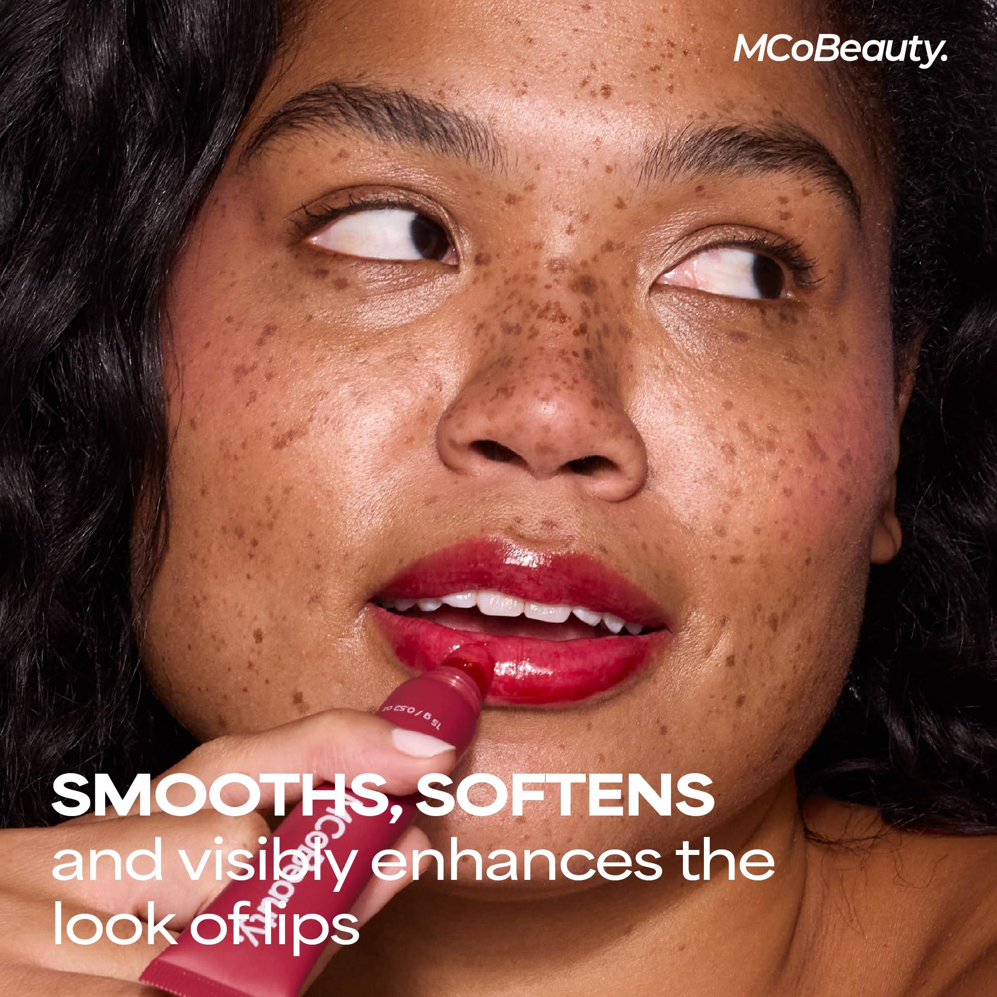MCoBeauty gloss on model lips demonstrating warm nude-beige sheen and smoothing benefit