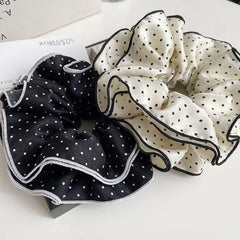 mdgfge scrunchie worn as bracelet on wrist adding fashionable convenience