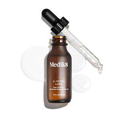 Medik8 serum placed on bathroom vanity in morning routine scene for daily use inspiration