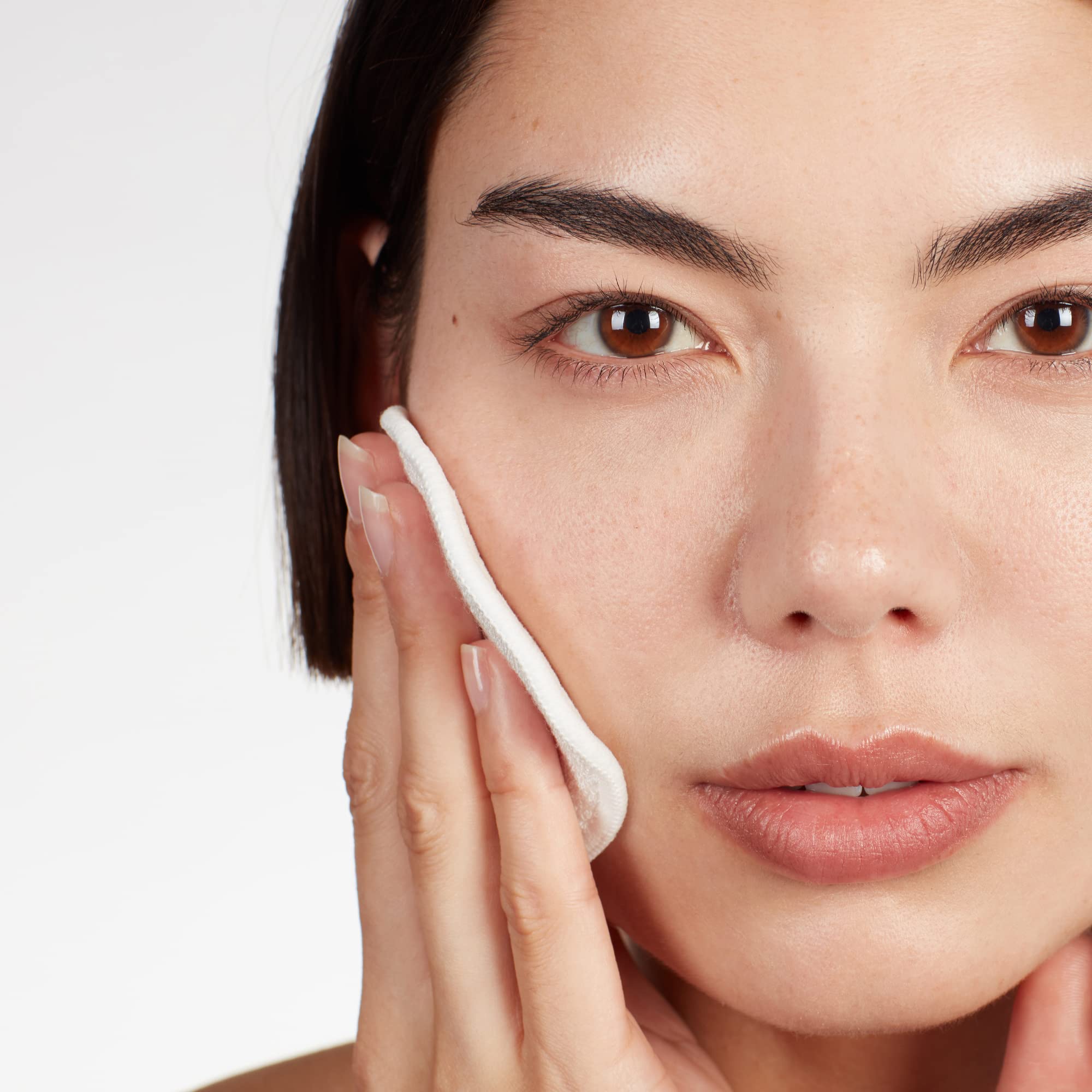 Medik8 applied to cotton pad showing easy application and gentle exfoliation