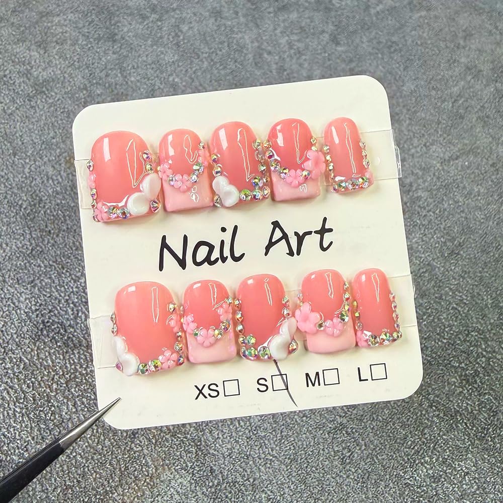 meemooron rhinestones and pink French tip focused to show sparkle appeal