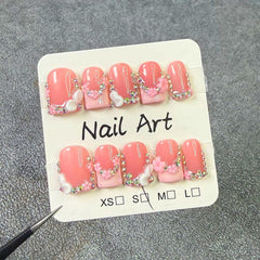 meemooron rhinestones and pink French tip focused to show sparkle appeal