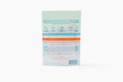 Megababe wipe used at beach providing cooling refresh after sun and activity