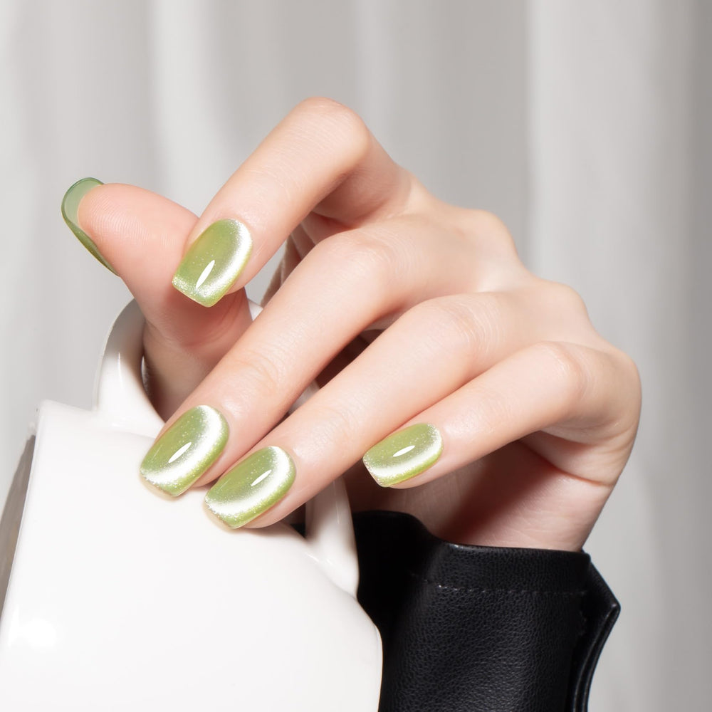 MEGIOR finished manicure on nails showing apple green holographic shine benefit