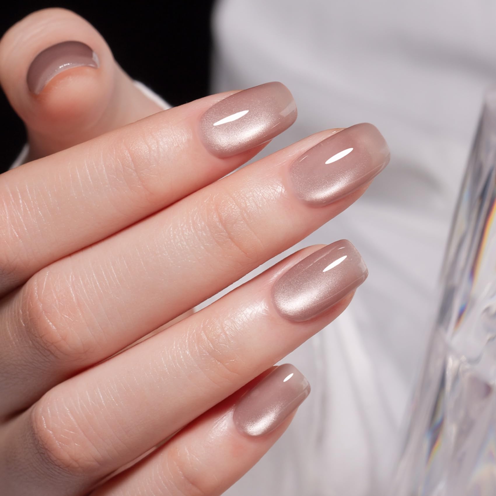 MEGIOR nail swatch on hand model showing wearable nude cat eye effect for styling ideas