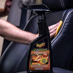 Meguiar's bottle on a car seat in a clean interior setting