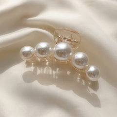 Mehayi styled on model at party showcasing decorative pearls for elegant looks