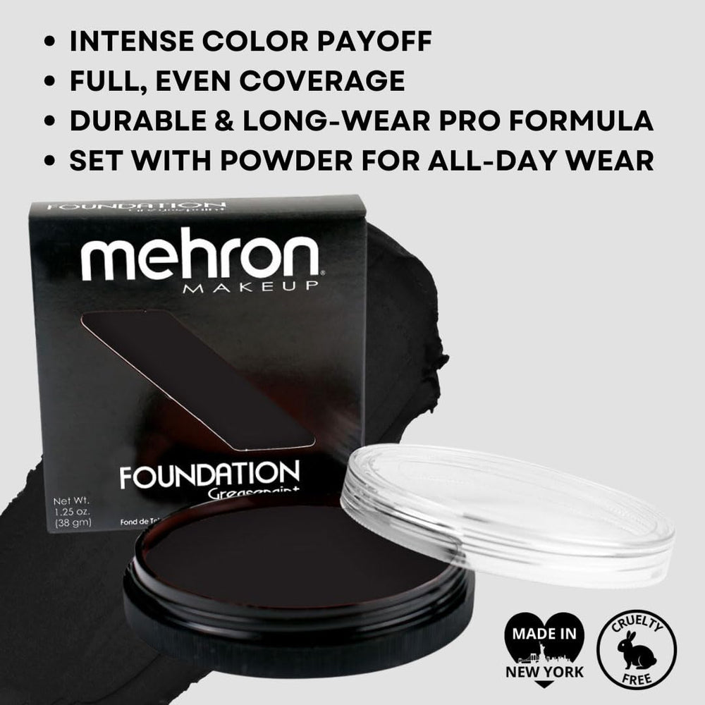 Mehron greasepaint black application with brush showing precise control and bold coverage