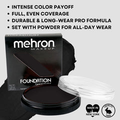 Mehron greasepaint black application with brush showing precise control and bold coverage