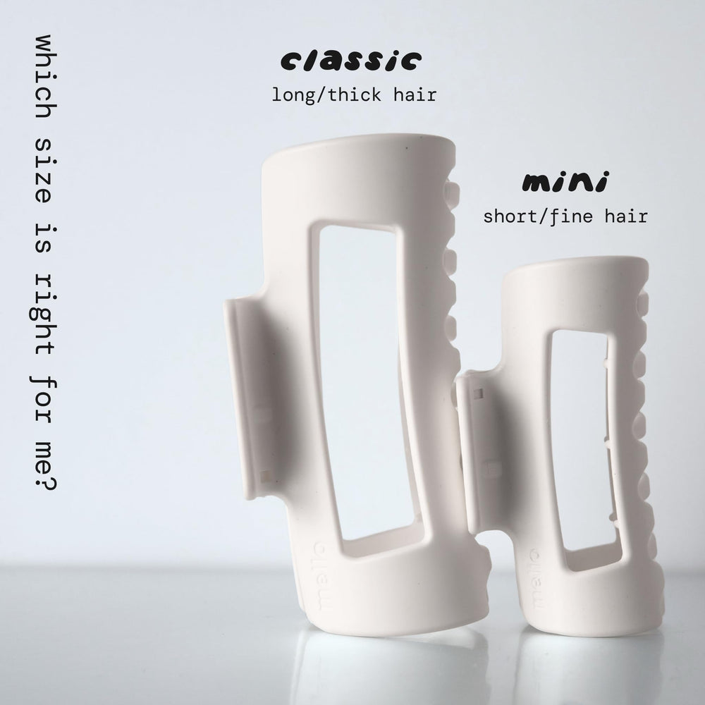 MELLO small hair clip held in hand showing compact size and easy portability benefit