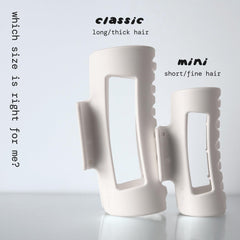 MELLO small hair clip held in hand showing compact size and easy portability benefit