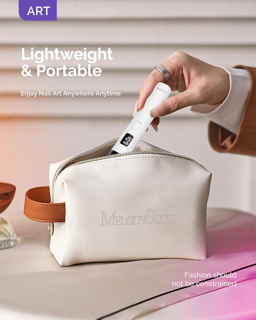 MelodySusie held in hand demonstrating pocket-sized portability