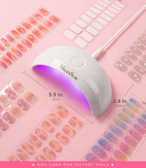 MelodySusie lamp next to smartphone showing scale and travel-friendly size advantage