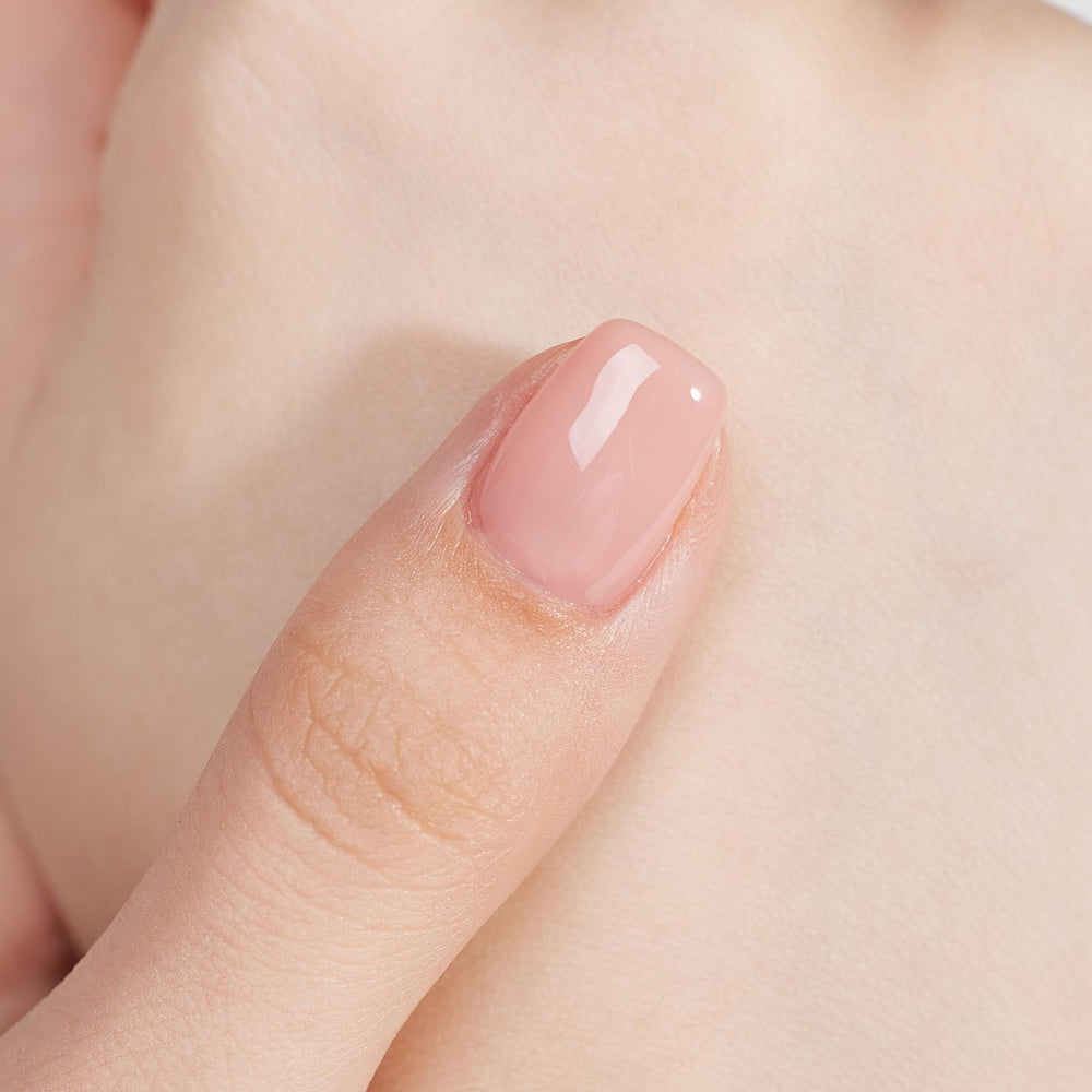 MEMEDA hand holding bottle for scale showing compact 15ml size benefit