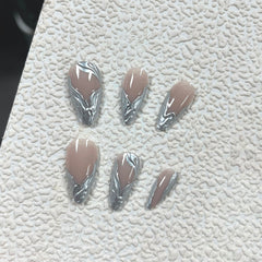 MERVF close-up of chrome French tip and 3D silver detail for reflective style