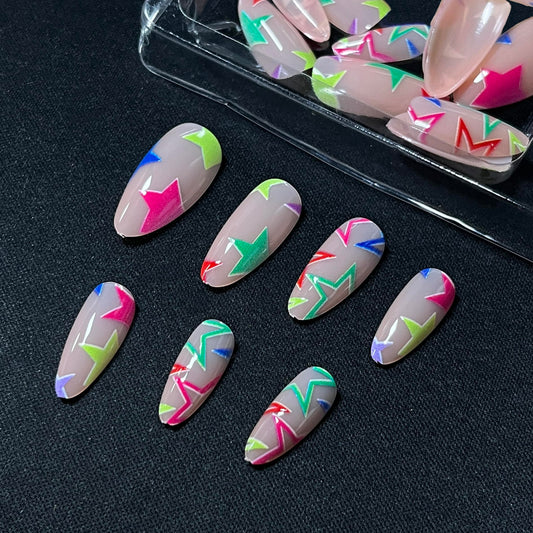 MERVF close-up of star design detail on a nail showcasing vibrant neon pattern and precise decoration