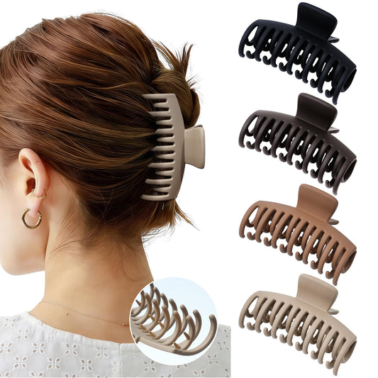 Mesovor front view of four matte claw clips showing neutral colors and compact size benefit
