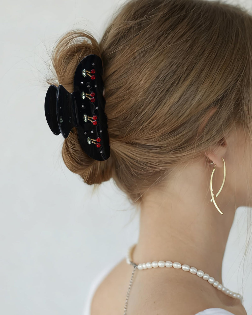 Mesovor clip worn in half-up hairstyle adding playful charm to hair