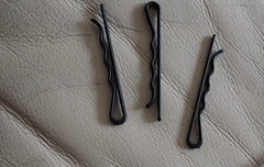 Metal Free Styling pins in a travel kit near passport and boarding pass, security-friendly