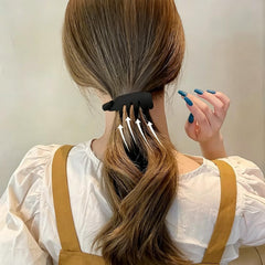 MEZYKAP clip held in hand to show compact size and travel-friendly benefit