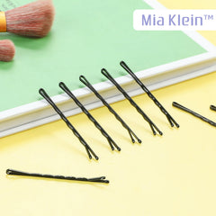 Mia Klein pins securing a tight bun on dark hair for discreet, long-lasting hold