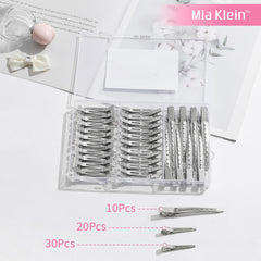 Mia Klein clip held in hand to show scale and ergonomic size options