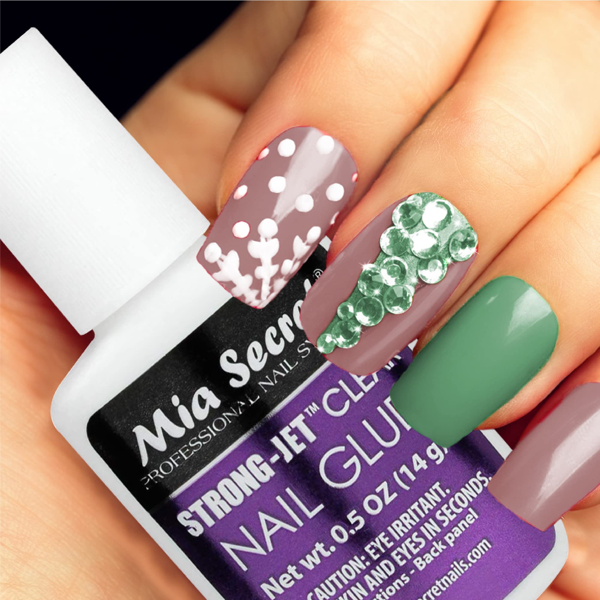 Mia Secret bottle pictured with tweezers and crystals for professional use