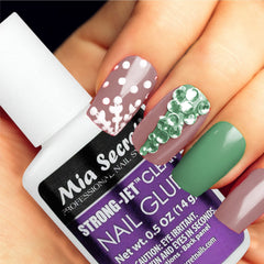 Mia Secret bottle pictured with tweezers and crystals for professional use