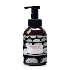 Michel Design Works front packaging showing amber bottle and artwork, upscale display benefit