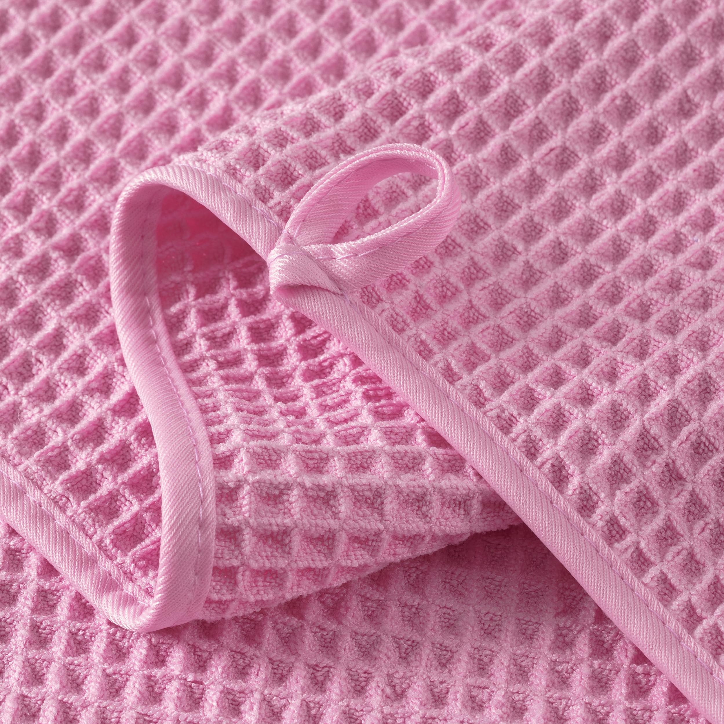 MICROFI towel held by hand showing 13x13 inch scale for easy facial coverage