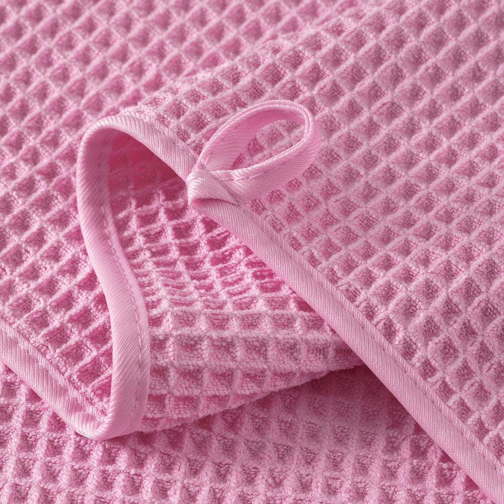 MICROFI towel held by hand showing 13x13 inch scale for easy facial coverage