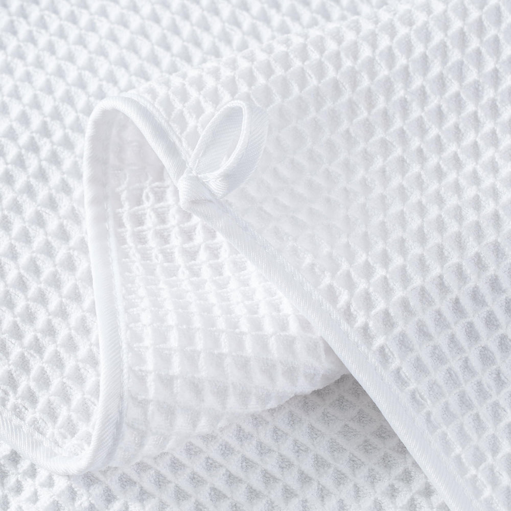 MICROFI towel edge and label detail showing OEKO-TEX safety certification benefit