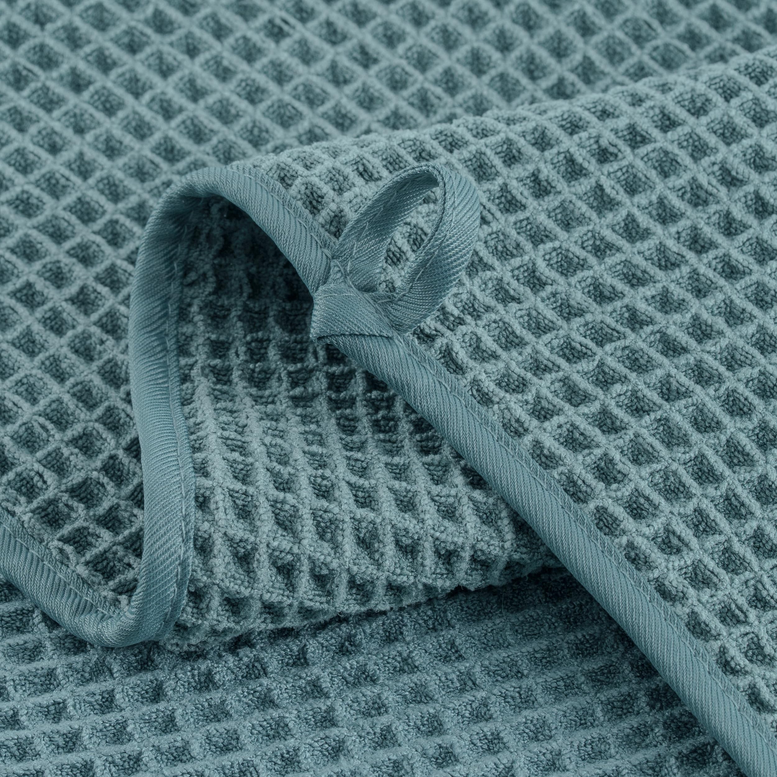 MICROFI towel beside ruler showing 12x12 inches size and portability benefit