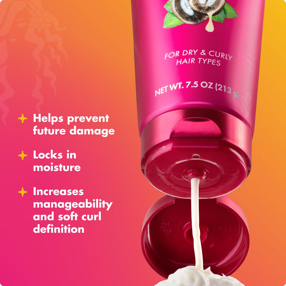 Mielle Organics curl cream being applied in hand for even coverage