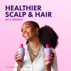 Mielle Organics bottle beside lavender and lychee fruit for natural appeal