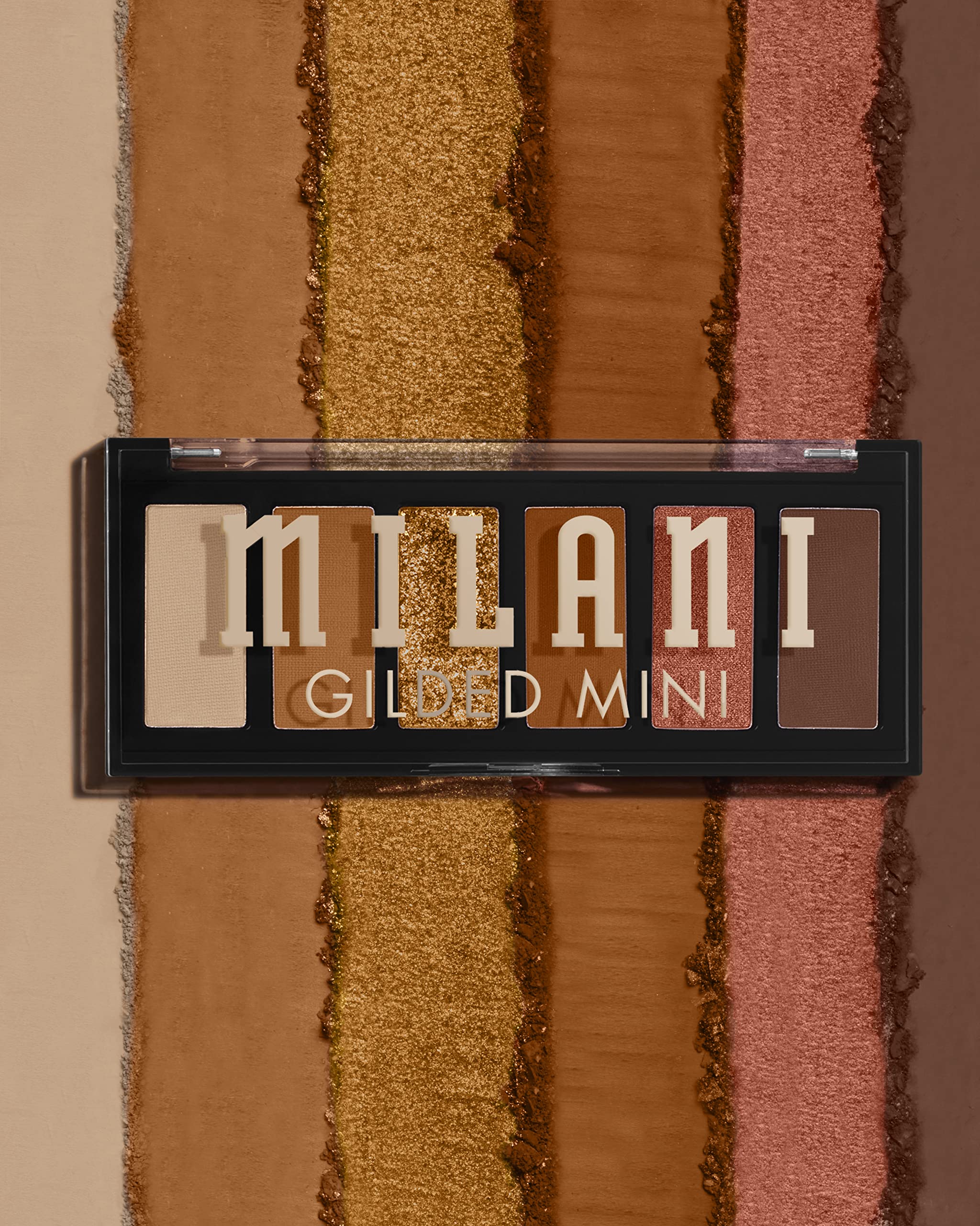 Milani compact closed beside a phone showing travel-friendly size