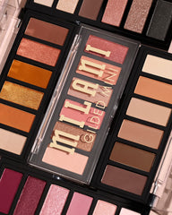 Milani palette staged with brushes to show full eye look potential