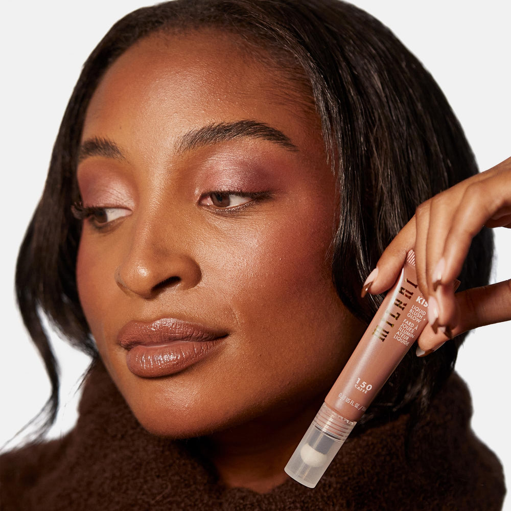 Milani Cheek Kiss swatch on arm demonstrating buildable color and glow