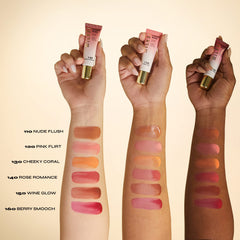 Milani bottle staged with pomegranate, rose, and watermelon to highlight skin-loving extracts