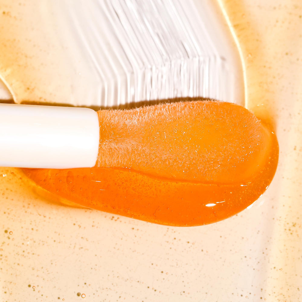 Milani open cap close-up showing precision wand and product texture